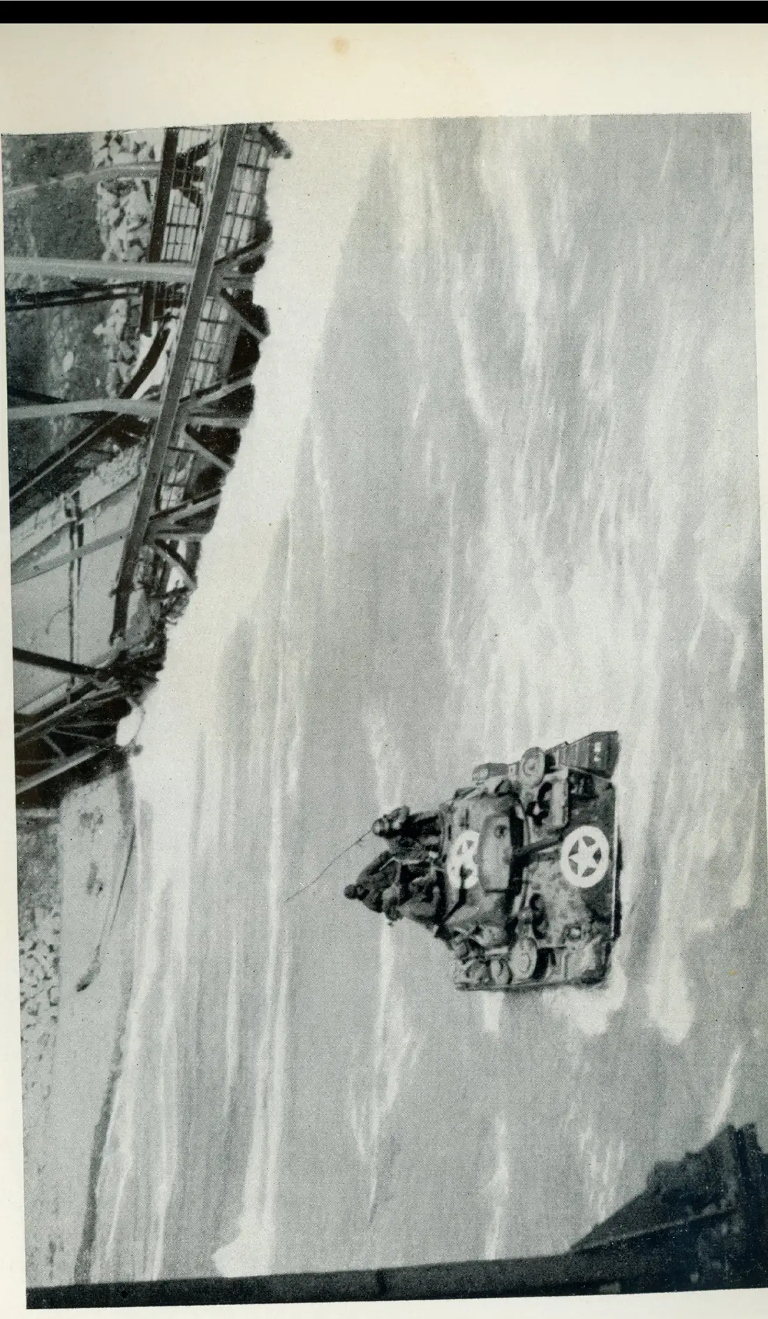 A wrecked tank/vehicle on the railway — the first to reach Salzburg