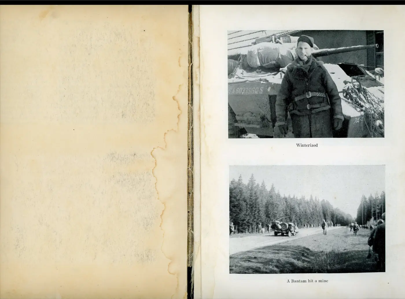 A soldier in heavy winter clothing standing beside a snow-laden armored car (serial USA 6033560-S)