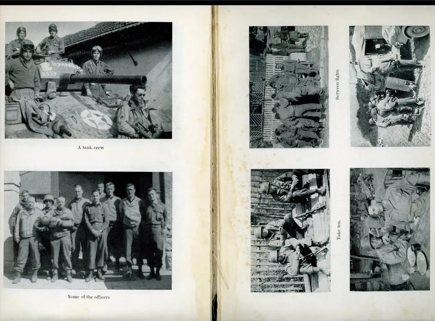 A tank crew posed on and around their tank